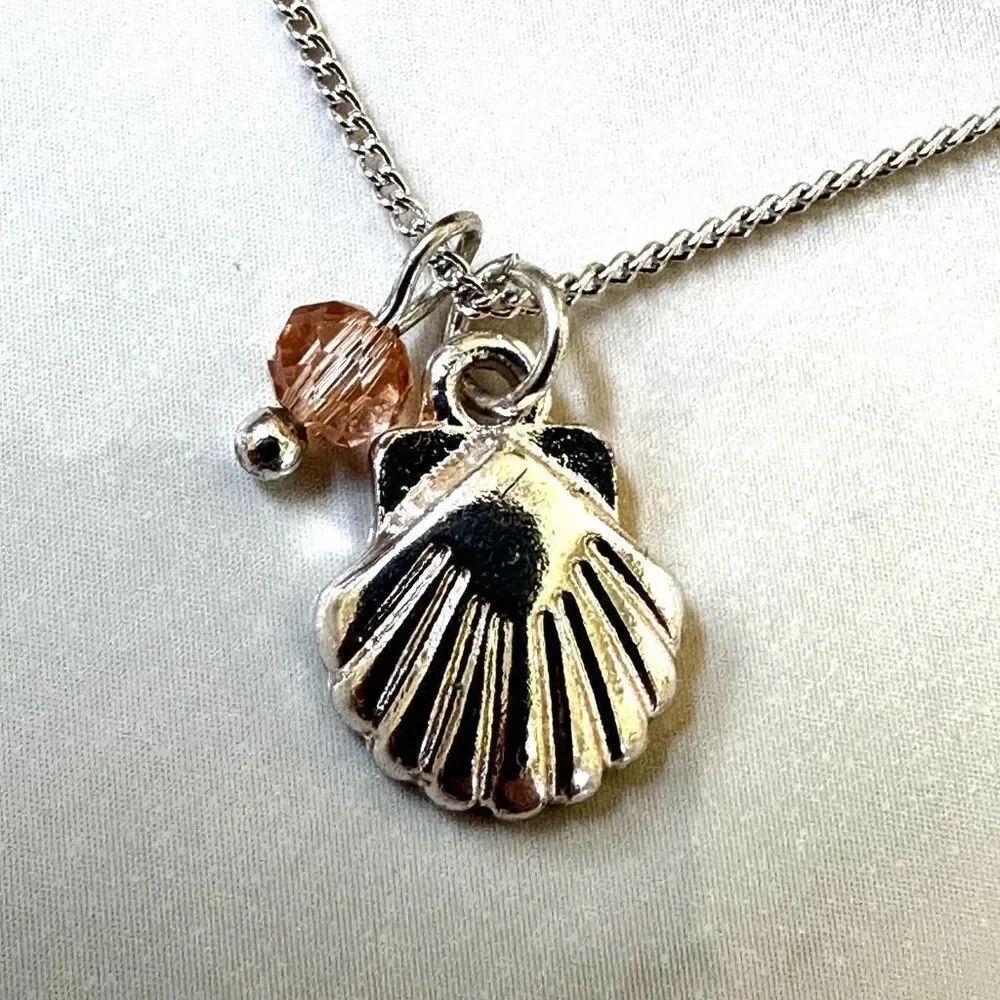 Silver tone shell charm bracelet